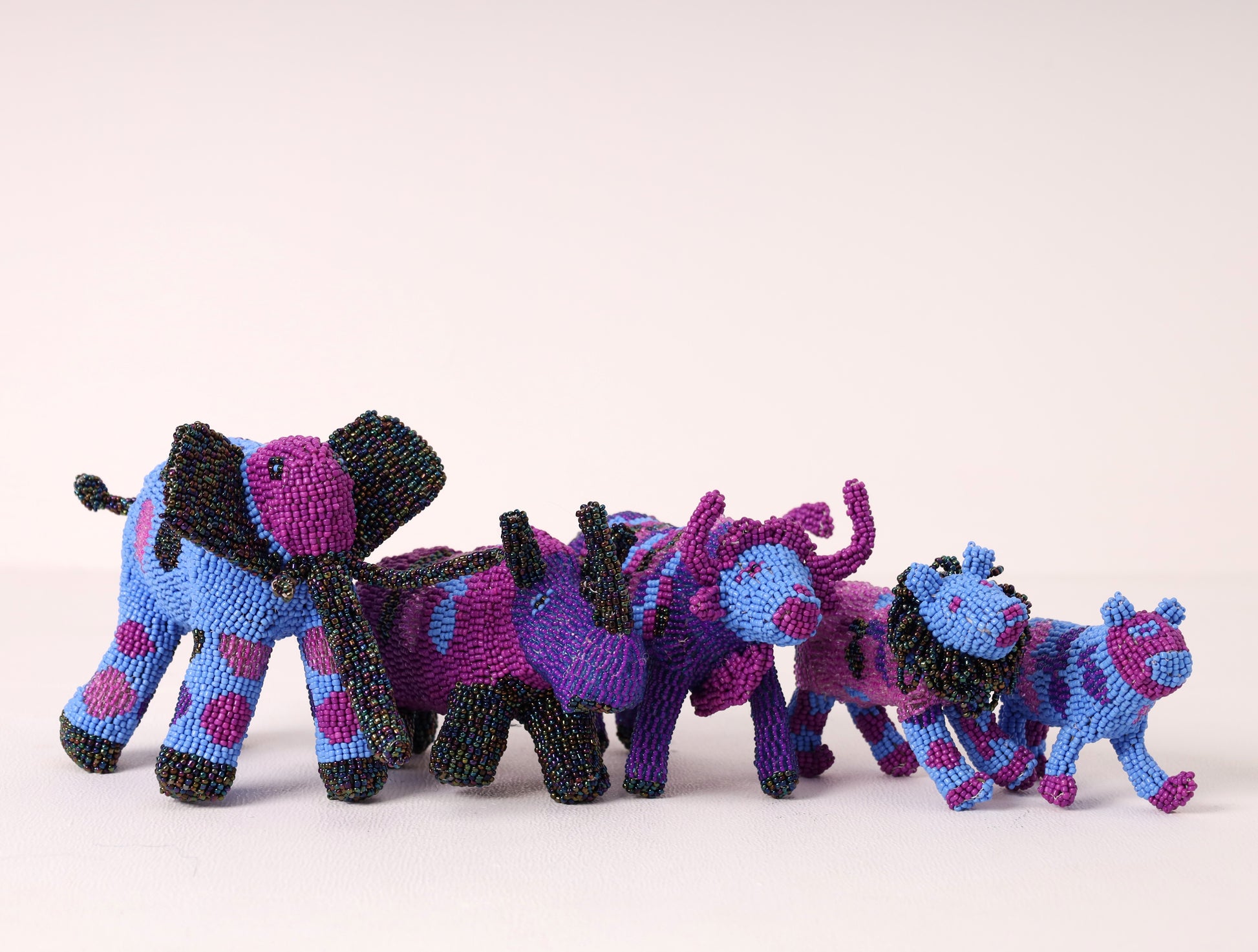 A handmade beaded big five sculpture, featuring a mix of colors. 